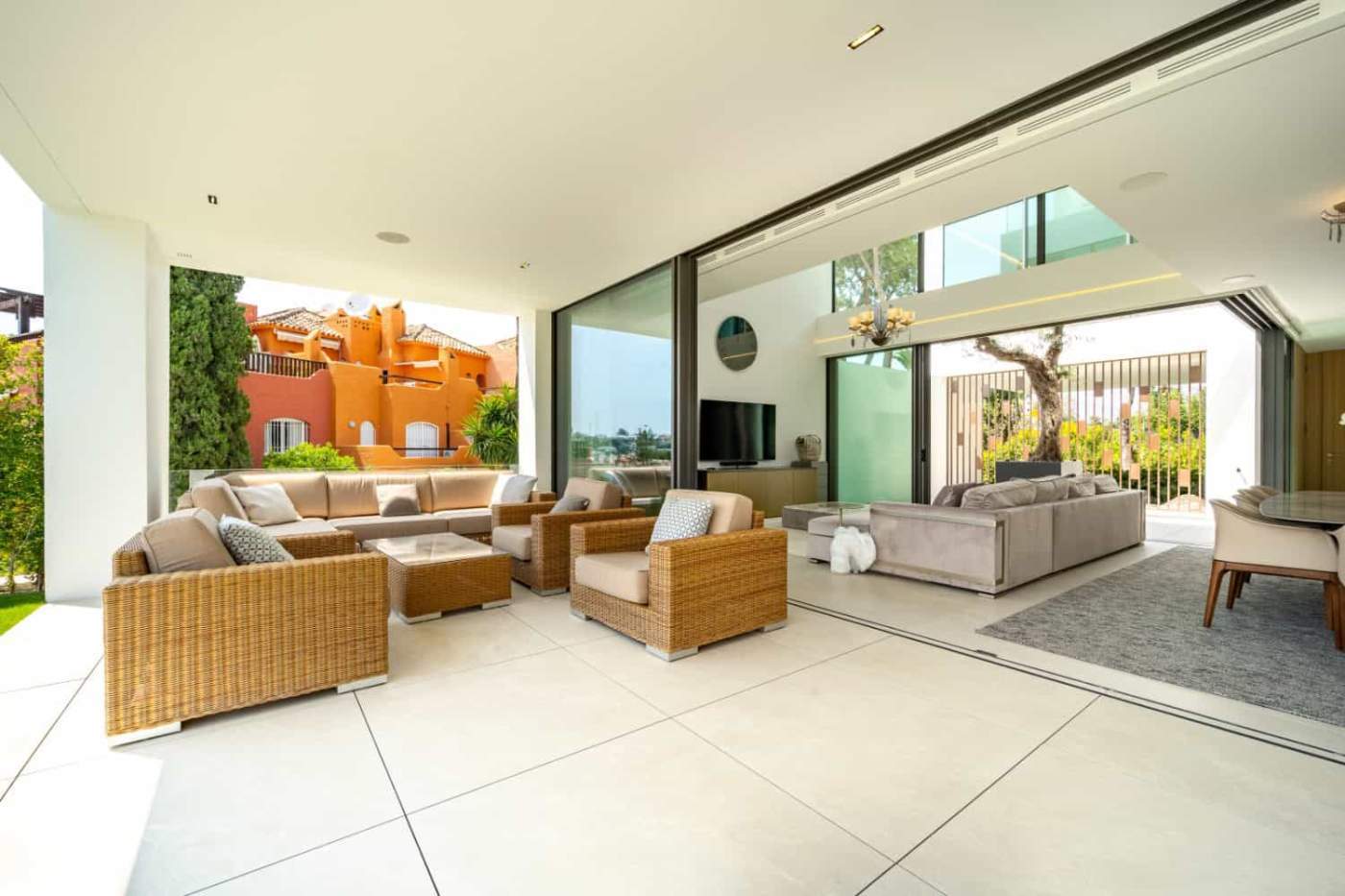 Contemporary Villa with Rooftop Pool and Views Luxurious modern villa featuring an open-plan living area with floor-to-ceiling windows and a stunni.
