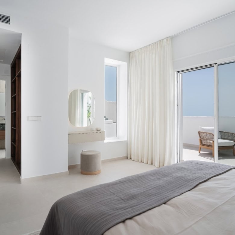 Elegant corner duplex penthouse with spacious living area and ocean views.