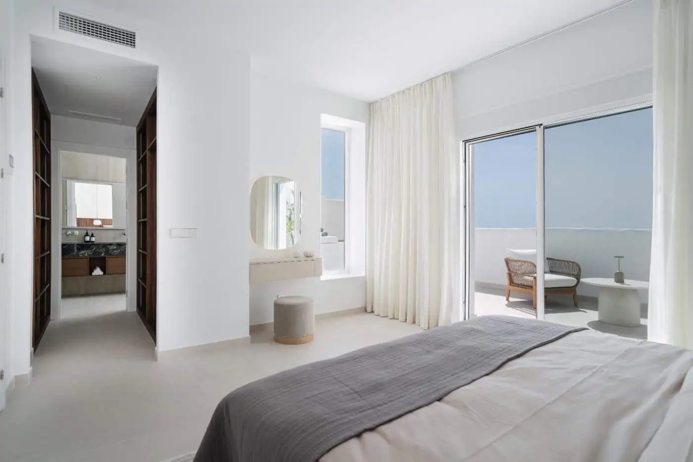 Elegant corner duplex penthouse with spacious living area and ocean views.