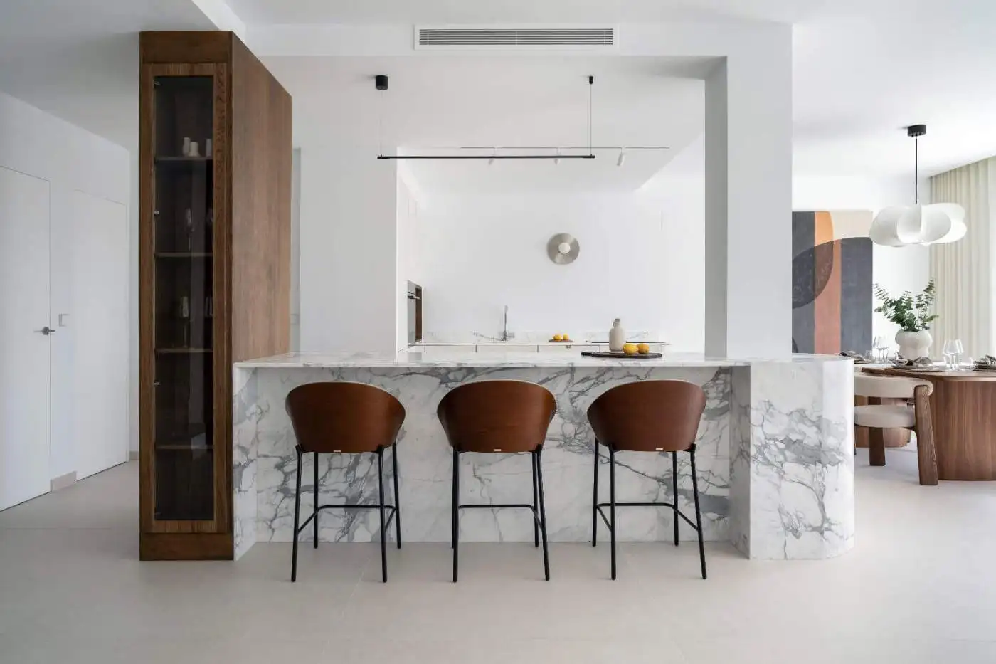 Spacious kitchen in La Quinta Village Corner Duplex Penthouse featuring a marble island and contempo.
