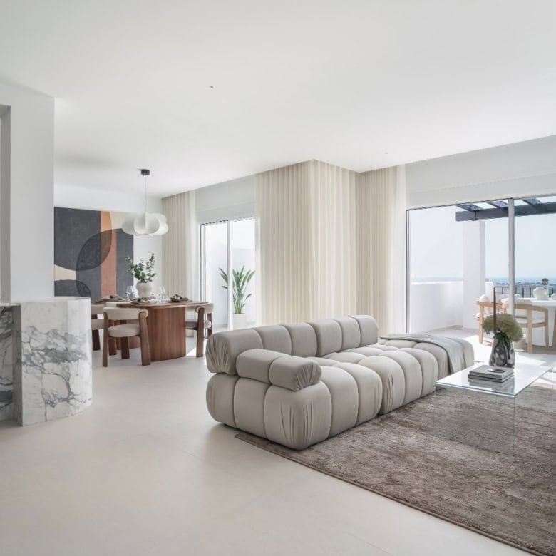 Luxury duplex penthouse living room with modern decor and panoramic city views.