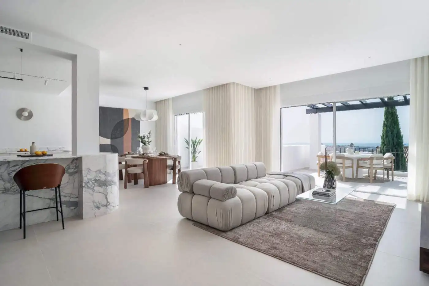 Luxury duplex penthouse living room with modern decor and panoramic city views.