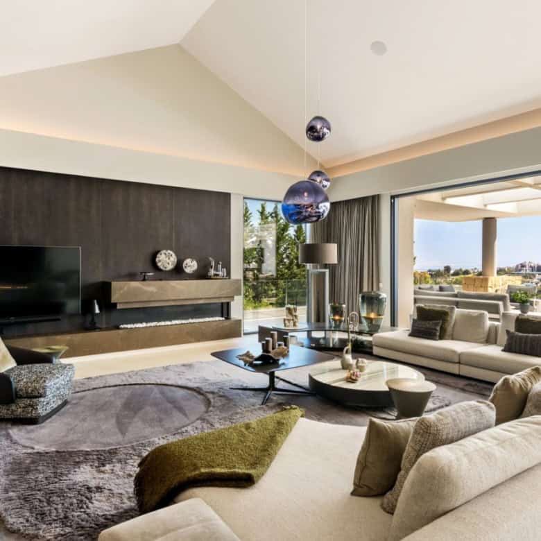 Elegant modern villa interior with spacious seating and panoramic views in Los Flamingos Resort.
