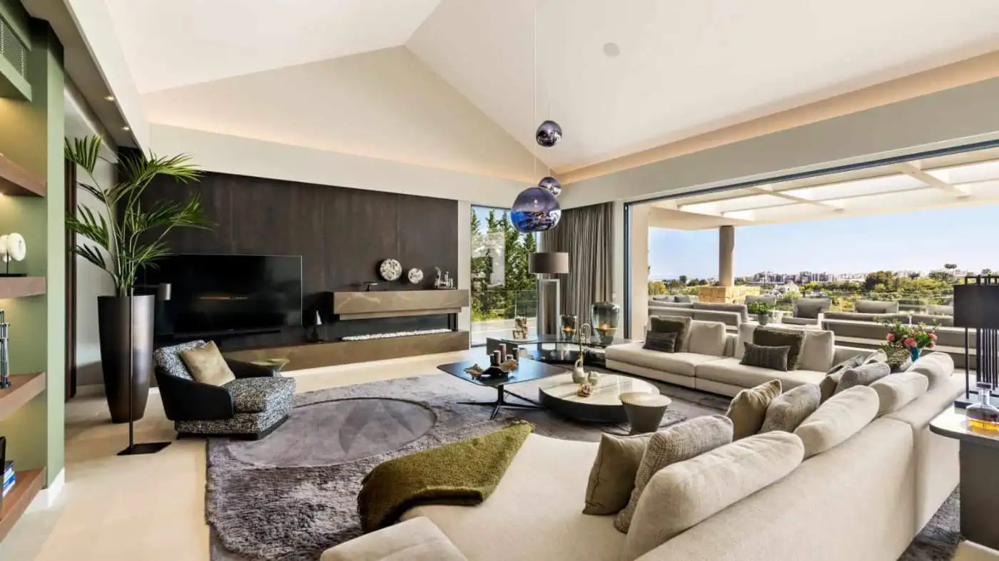 Elegant modern villa interior with spacious seating and panoramic views in Los Flamingos Resort.