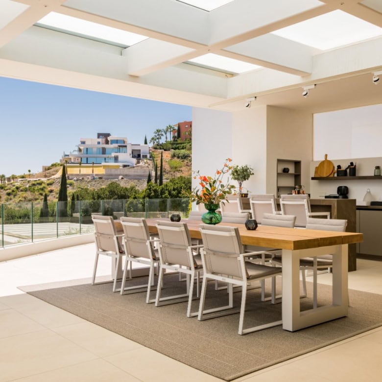Elegant modern villa dining space with panoramic views in Los Flamingos Resort.
