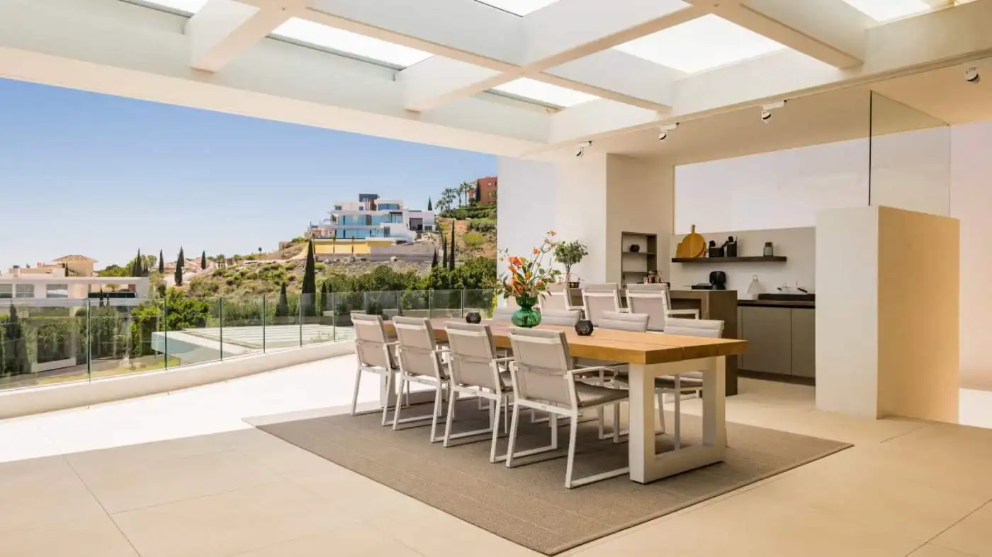 Elegant modern villa dining space with panoramic views in Los Flamingos Resort.