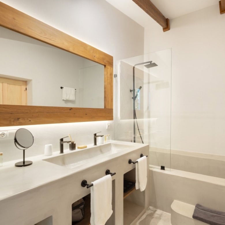 Elegant bathroom featuring a bathtub, walk-in shower, and contemporary fixtures.
