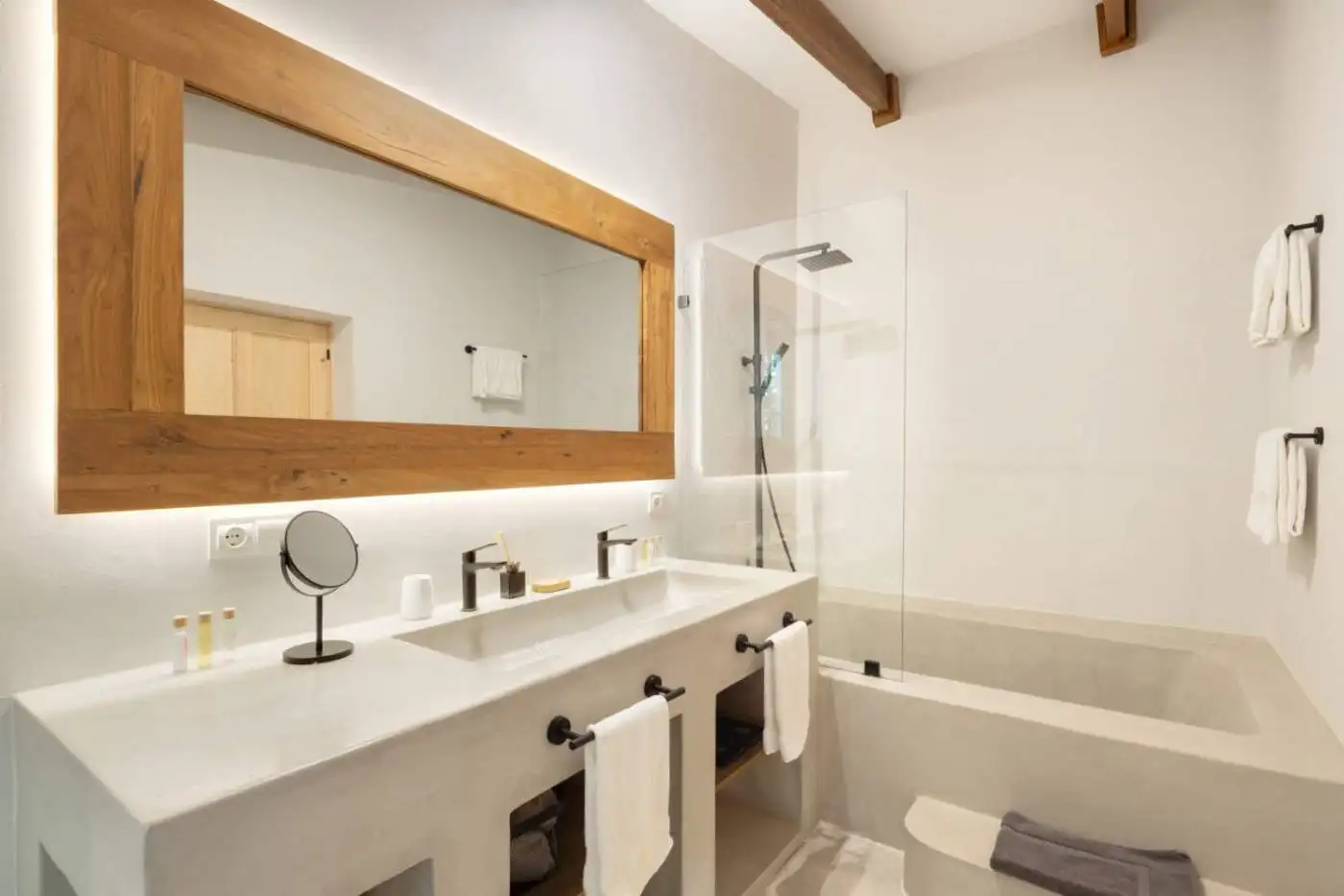 Elegant bathroom featuring a bathtub, walk-in shower, and contemporary fixtures.