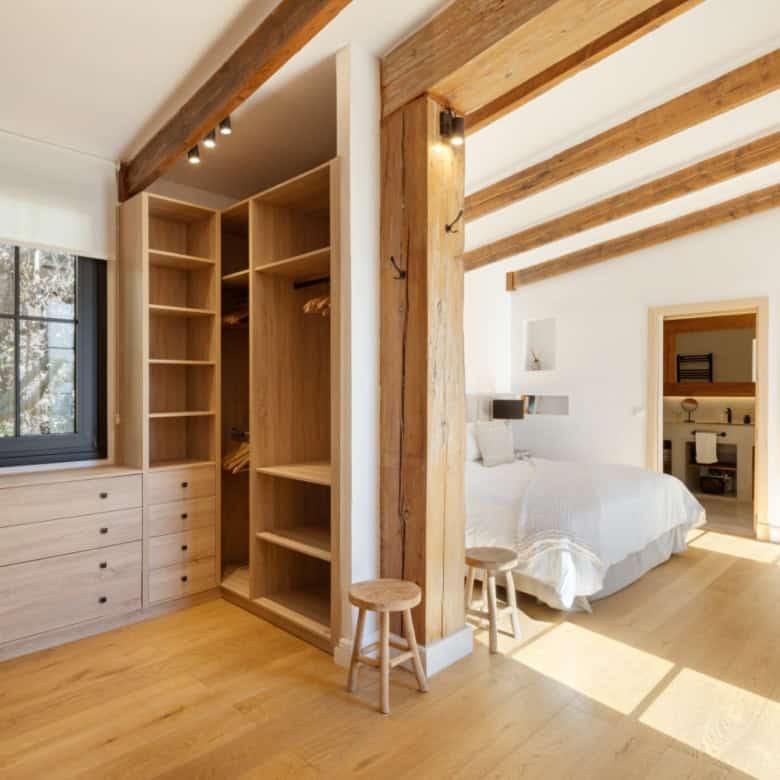 Beautiful Casa Teresita bedroom with wooden beams and modern decor.