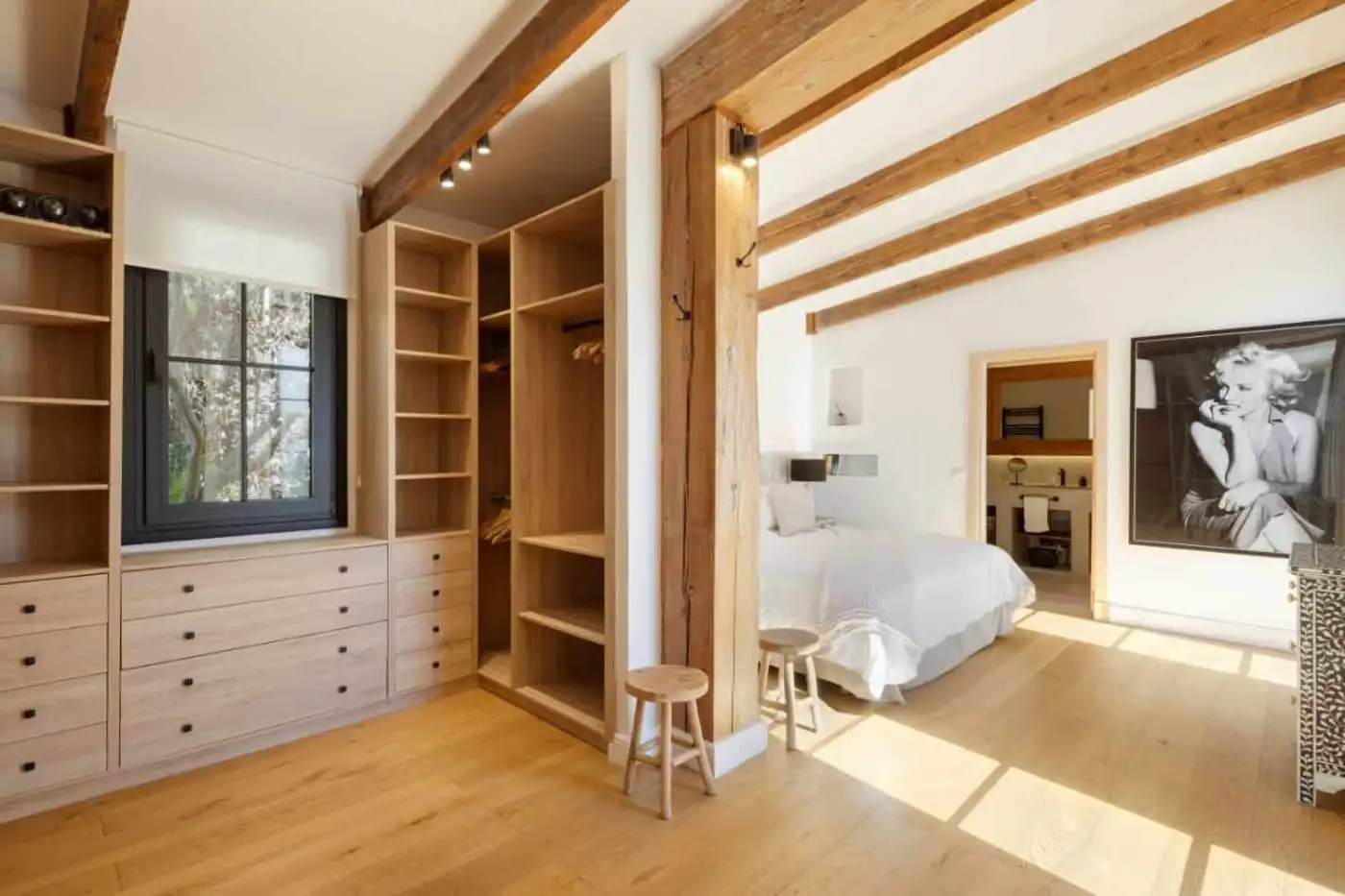 Beautiful Casa Teresita bedroom with wooden beams and modern decor.
