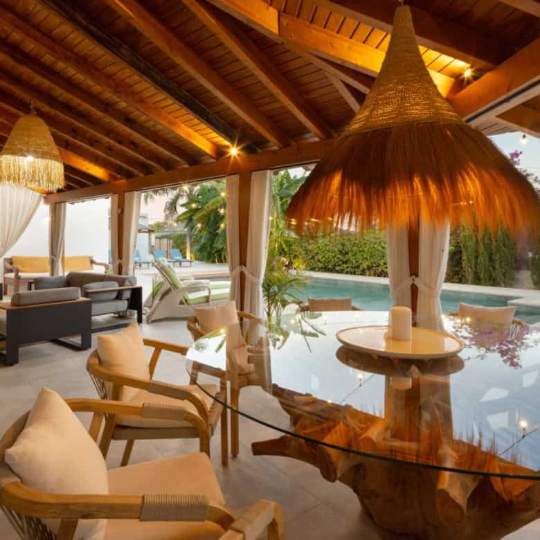 Beautiful outdoor living space at Casa Teresita with a pool and tropical garden.