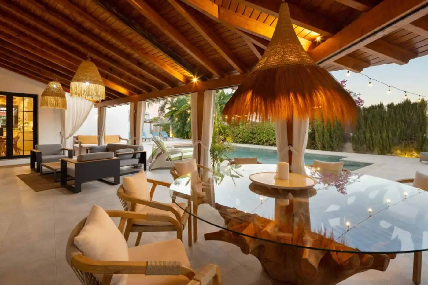 Beautiful outdoor living space at Casa Teresita with a pool and tropical garden.