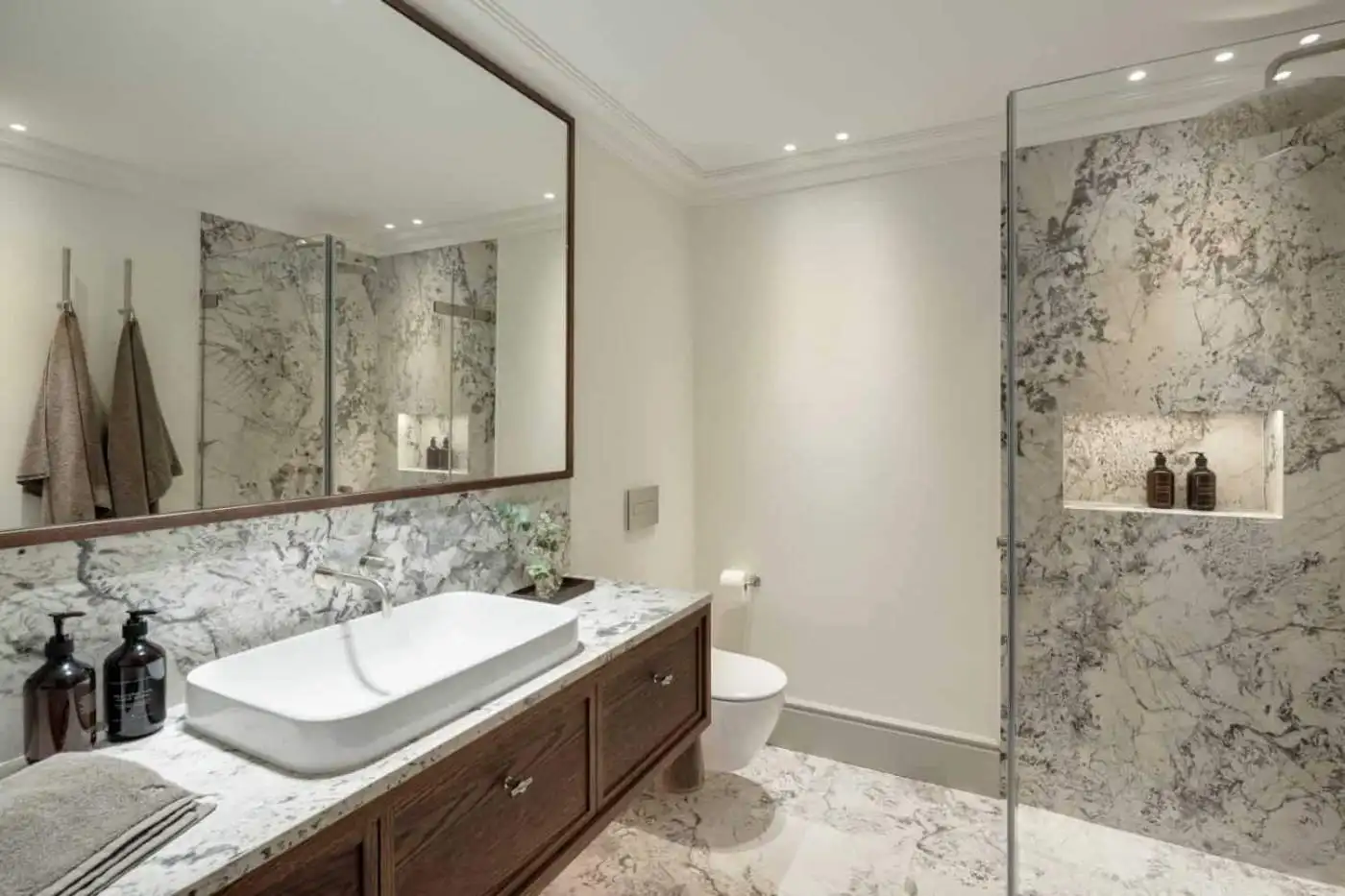 Modern bathroom with marble finishes and elegant fixtures in La Zagaleta villa.