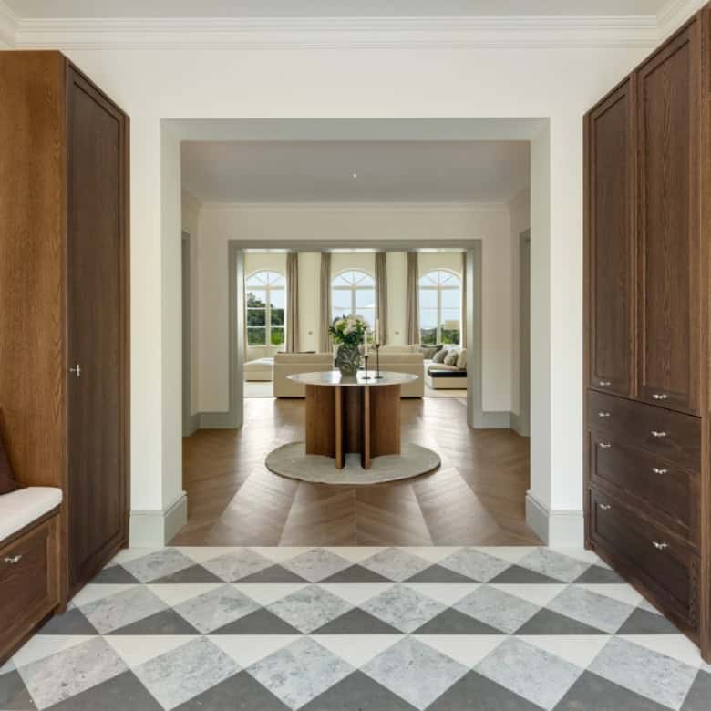 Spacious villa interior featuring stylish wooden cabinetry and a bright, airy living space with larg.