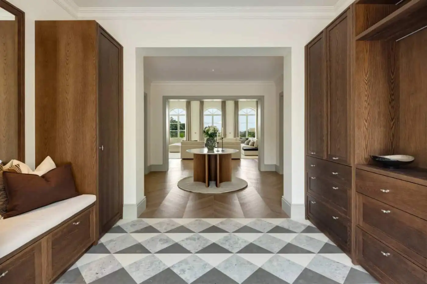 Spacious villa interior featuring stylish wooden cabinetry and a bright, airy living space with larg.