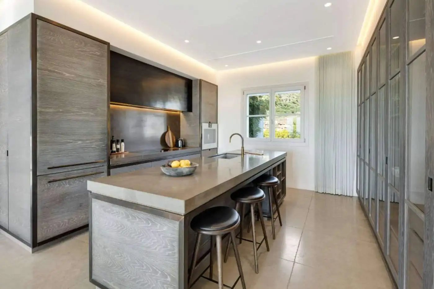 Luxury mansion kitchen with modern design and panoramic views in Marbella Club Golf Resort.