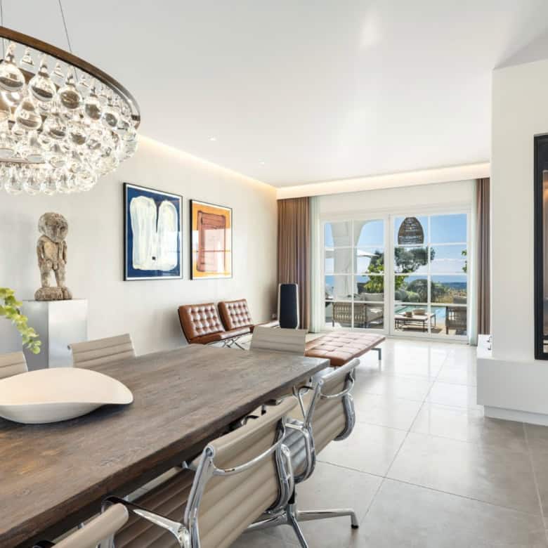 Elegant living room with panoramic vistas in Marbella Club Golf Resort. Modern design and luxurious.