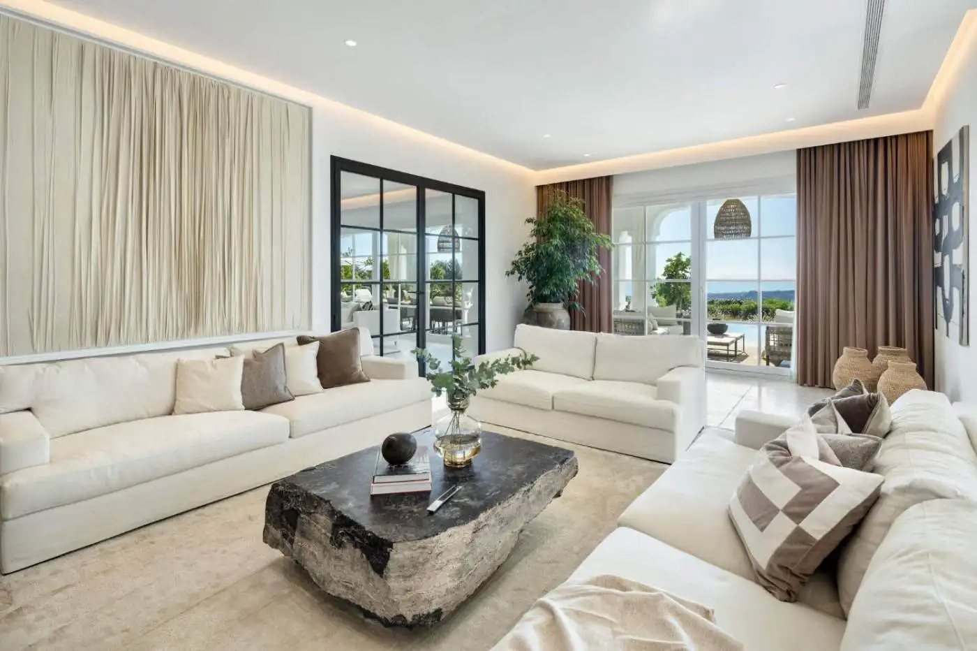 Elegant living room with panoramic sea views in Marbella Club Golf Resort.