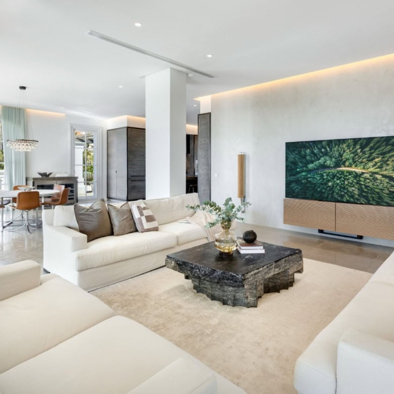Elegant living room with modern decor and panoramic views in Marbella.