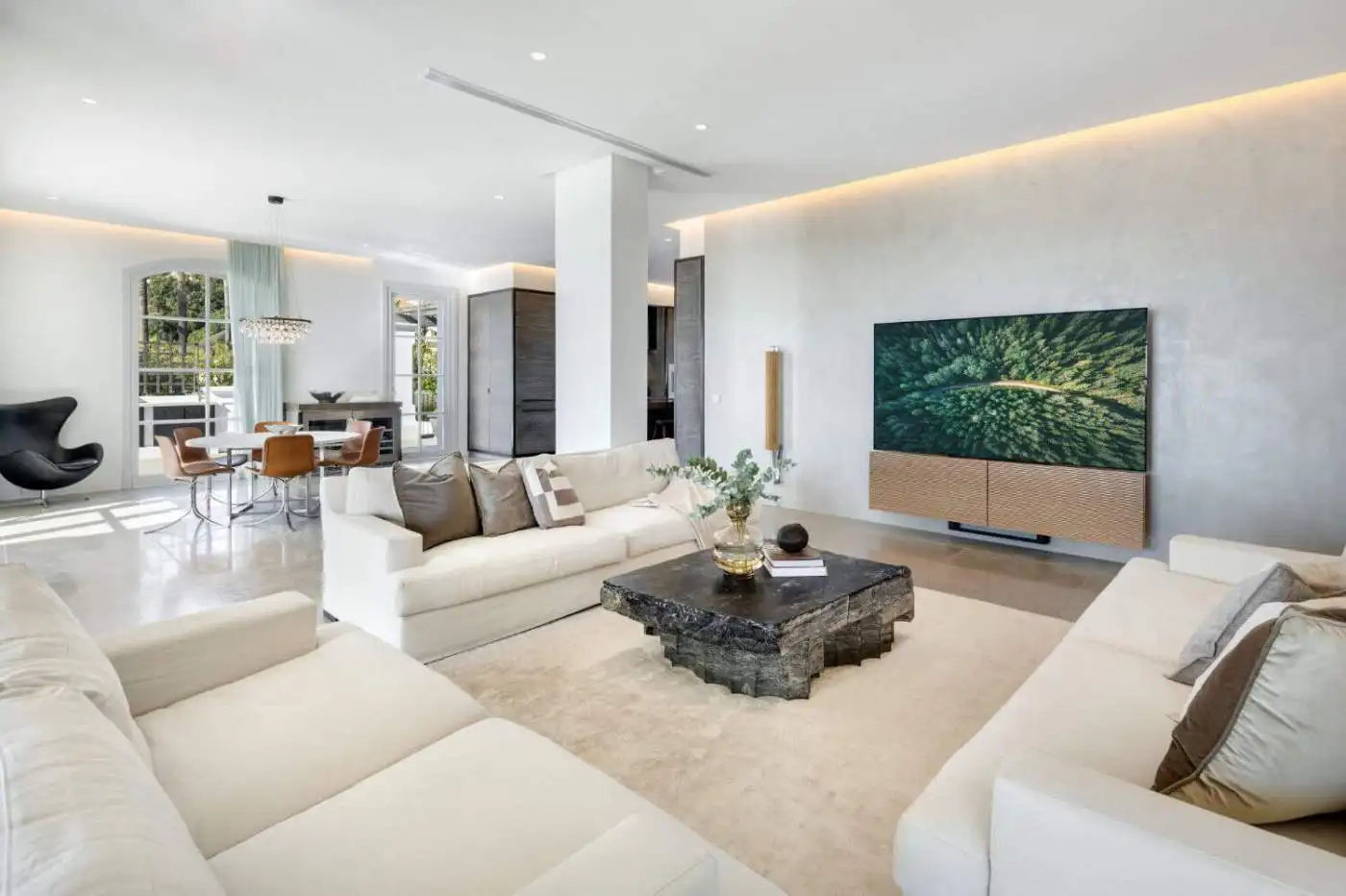 Elegant living room with modern decor and panoramic views in Marbella.