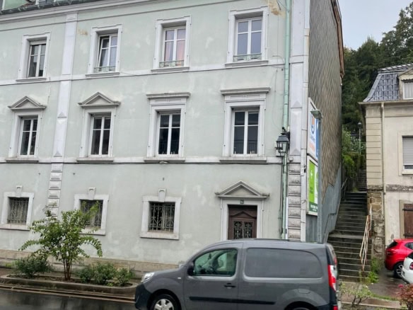 Spacious 3-bedroom apartment for sale in Altkirch, France, with classic architecture and central loc.