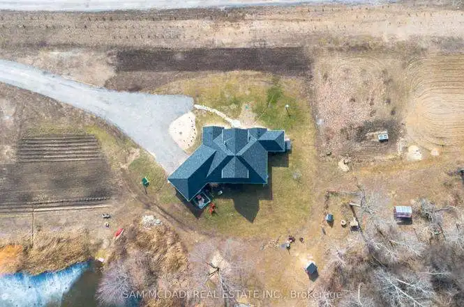 Beautiful aerial view of a spacious 3-bedroom estate in Belmont, Ontario, showcasing its modern desi.