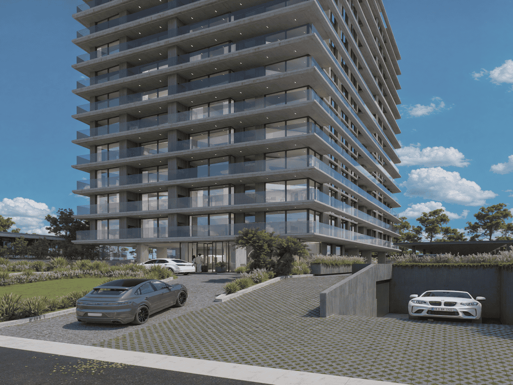 Modern high-rise residential building in Punta del Este, Uruguay. High-rise apartment building in Punta del Este, Uruguay, with parking area and landscaped surroundin.
