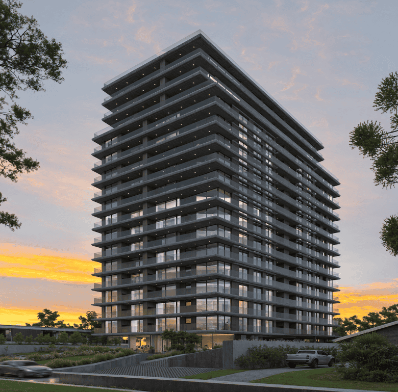 Contemporary high-rise apartment building in Punta del Este, Uruguay at sunset.