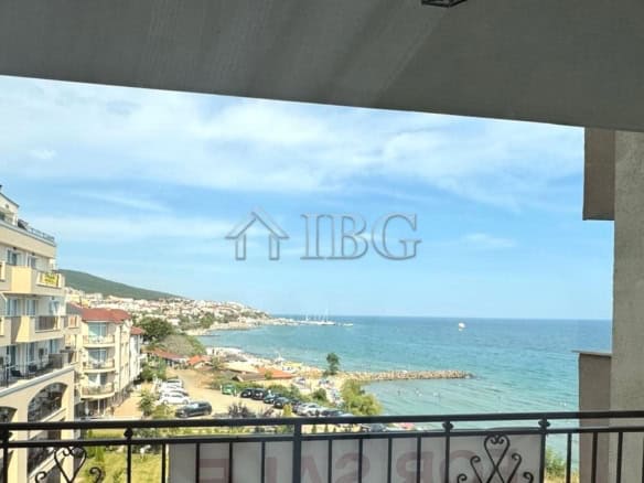 Comfortable bedroom with sea view and contemporary furnishings.