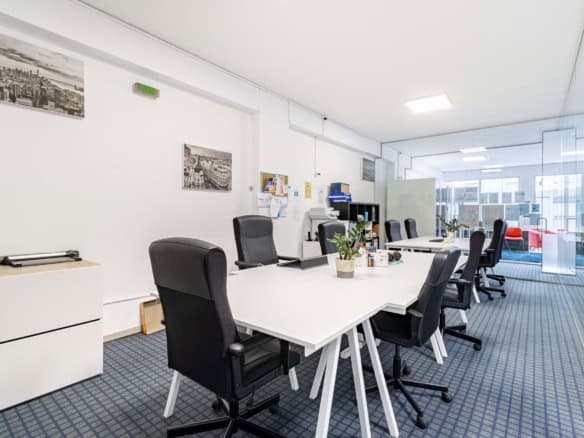 Office interior with modern furniture and large windows in Porto.