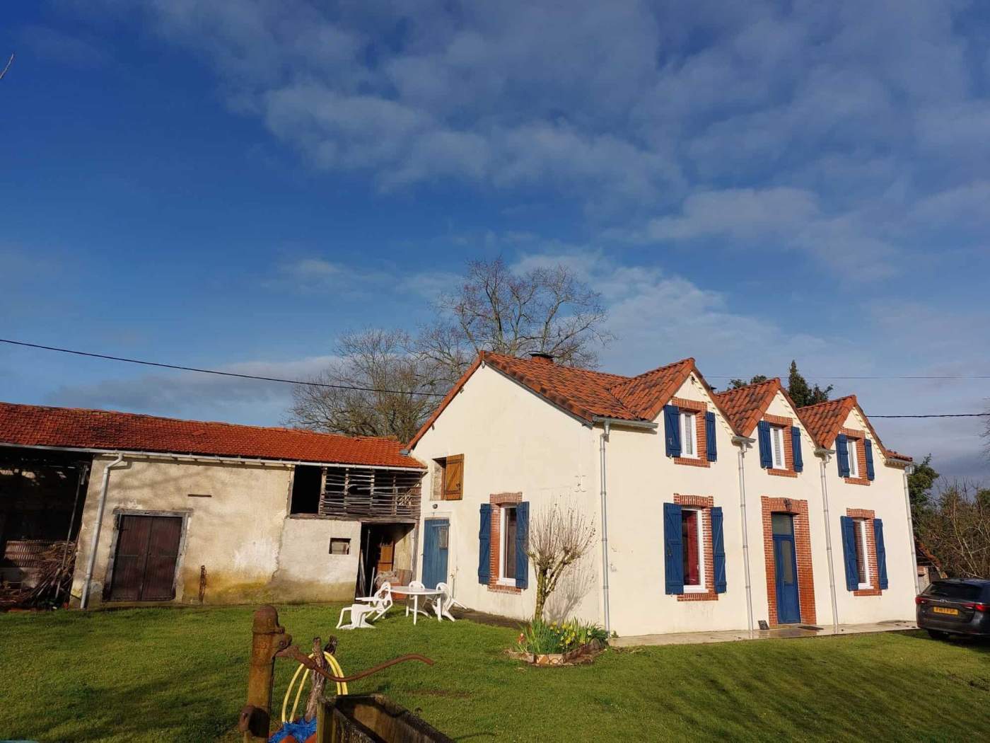 Charming Farmhouse in Madiran Village France Beautiful farmhouse with traditional architecture in Madiran, France, featuring a white facade and b.