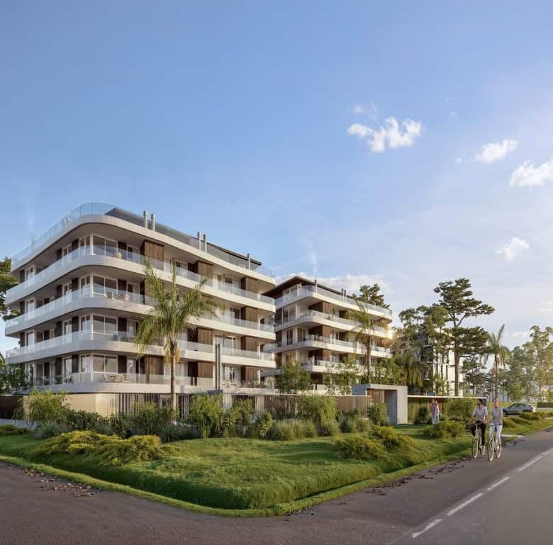 Contemporary apartment building in Montevideo, Uruguay with lush landscaping and ocean views.