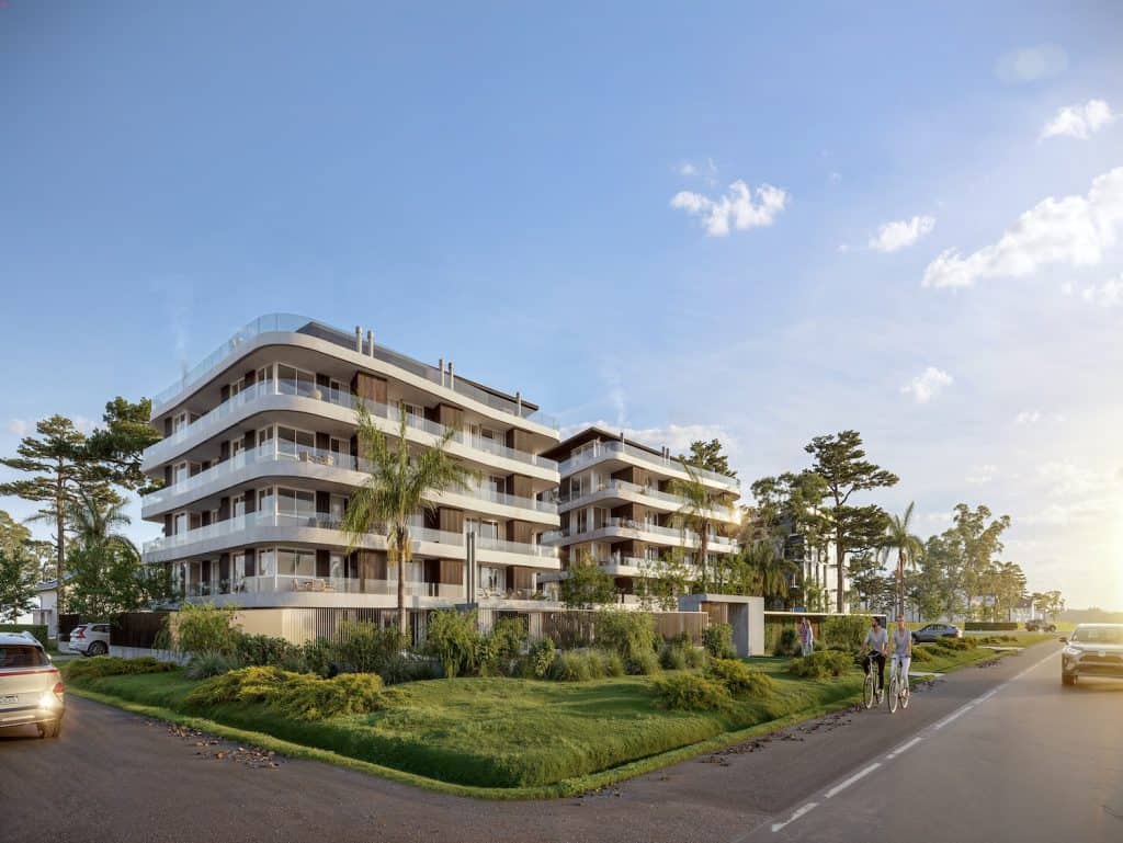 Contemporary apartment building in Montevideo, Uruguay with lush landscaping and ocean views.
