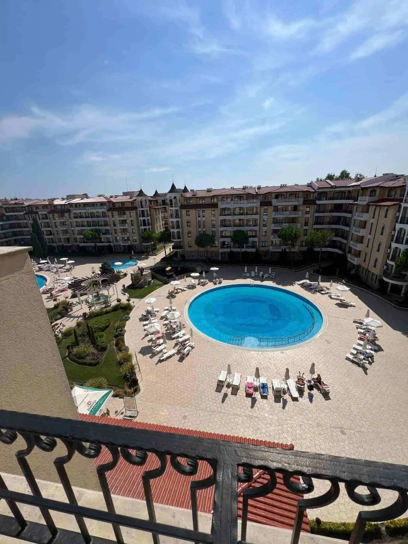 Pool view from balcony of one-bedroom apartment in Royal Sun, Sunny Beach. Modern complex with pool,.