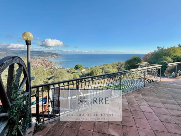 Breathtaking panoramic view from a villa terrace overlooking Diano Marina and the Ligurian Sea.