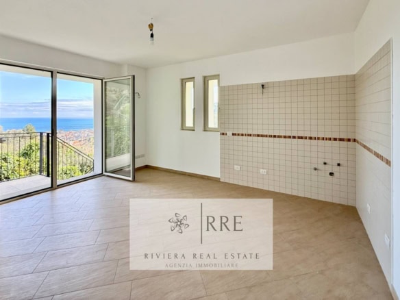 Bright, modern two-room apartment with sea view in Alassio, featuring a living area, sofa, and dinin.