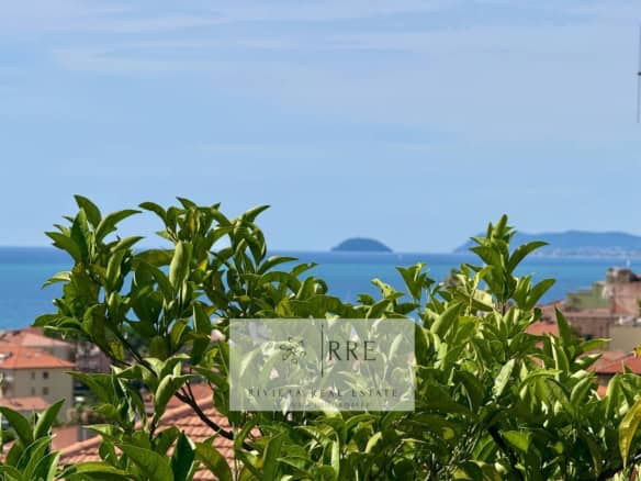 Seaview villa in Borgio Verezzi with lush greenery and coastal views, perfect for a Mediterranean li.