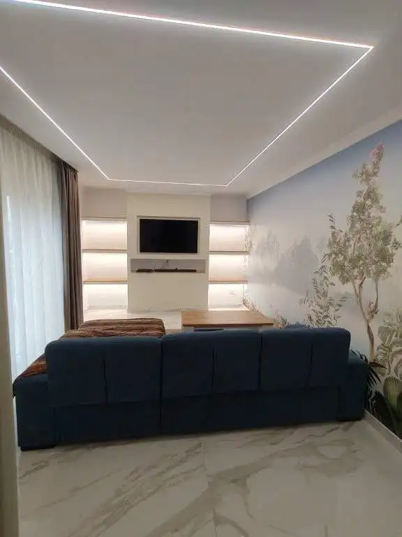 Modern living room with stylish decor and ambient lighting in Bernalda Italy.