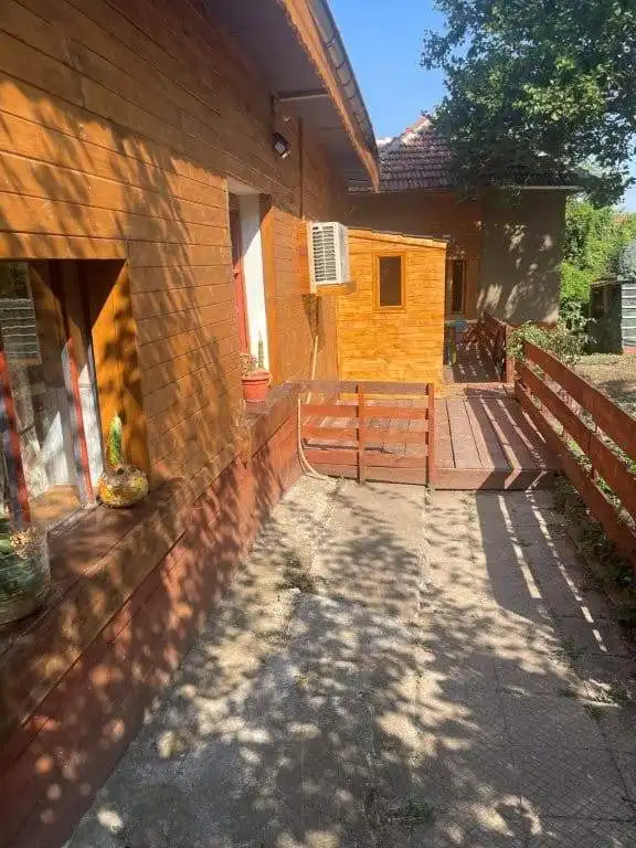 Cozy 4-bedroom country house in Traykovo, Bulgaria, with wooden accents and a spacious outdoor deck.