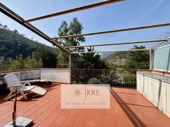 Luxury terrace with mountain views and outdoor seating.