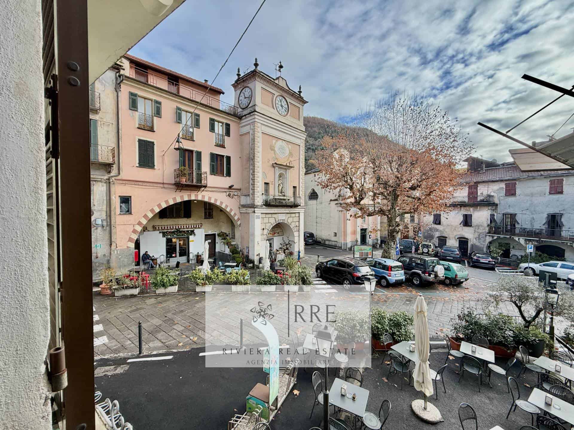 Beautiful view of a historic town square featuring classic European buildings and a clock tower.