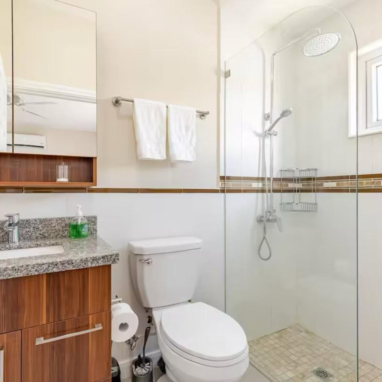Luxury bathroom with walk-in shower and contemporary fixtures in a Jamaican seaside property.