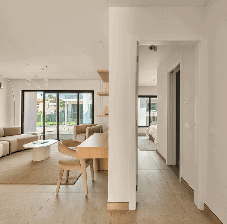 Bright Algarve living room with modern furniture, large windows, and natural light. Perfect for comf.