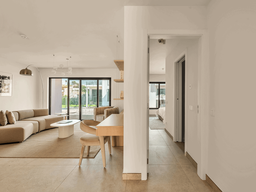 Bright Algarve living room with modern furniture, large windows, and natural light. Perfect for comf.
