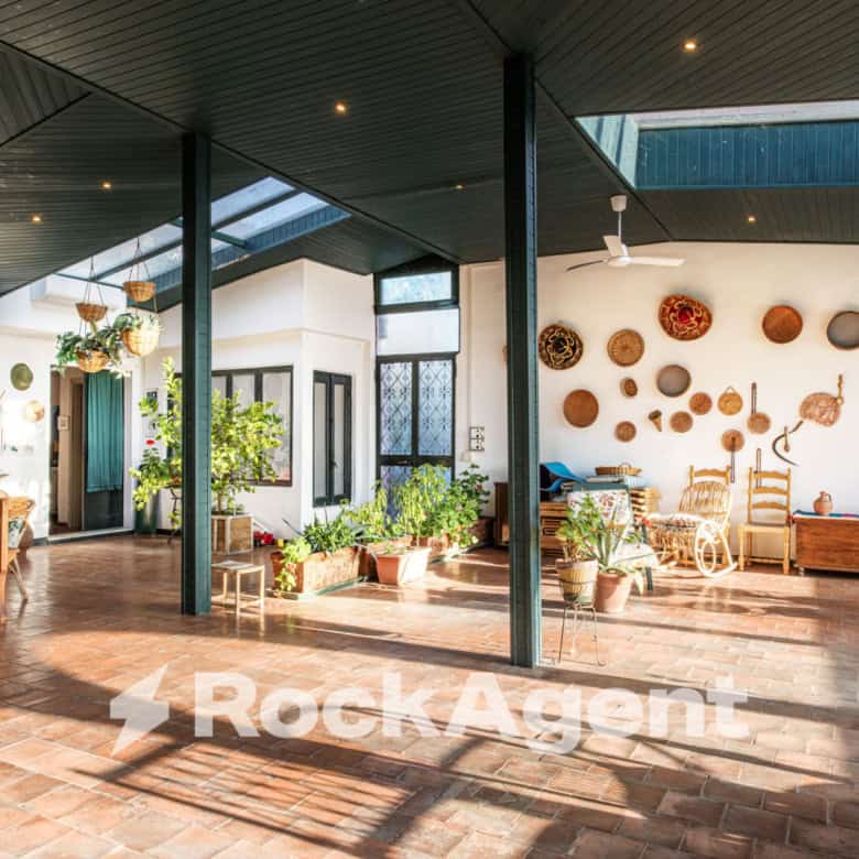 Spacious interior of a luxury 6-bedroom villa in Varzi, Italy, featuring modern design and ample nat.