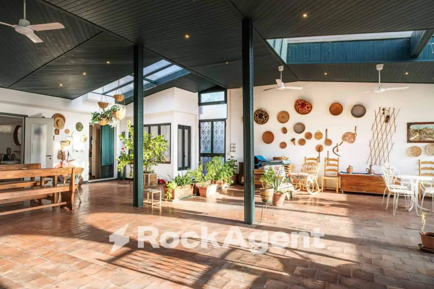 Spacious interior of a luxury 6-bedroom villa in Varzi, Italy, featuring modern design and ample nat.