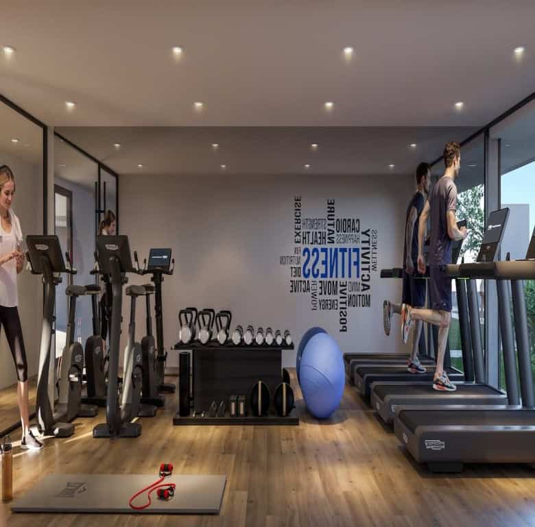 State-of-the-art gym with treadmills, weights, and scenic views for fitness enthusiasts.