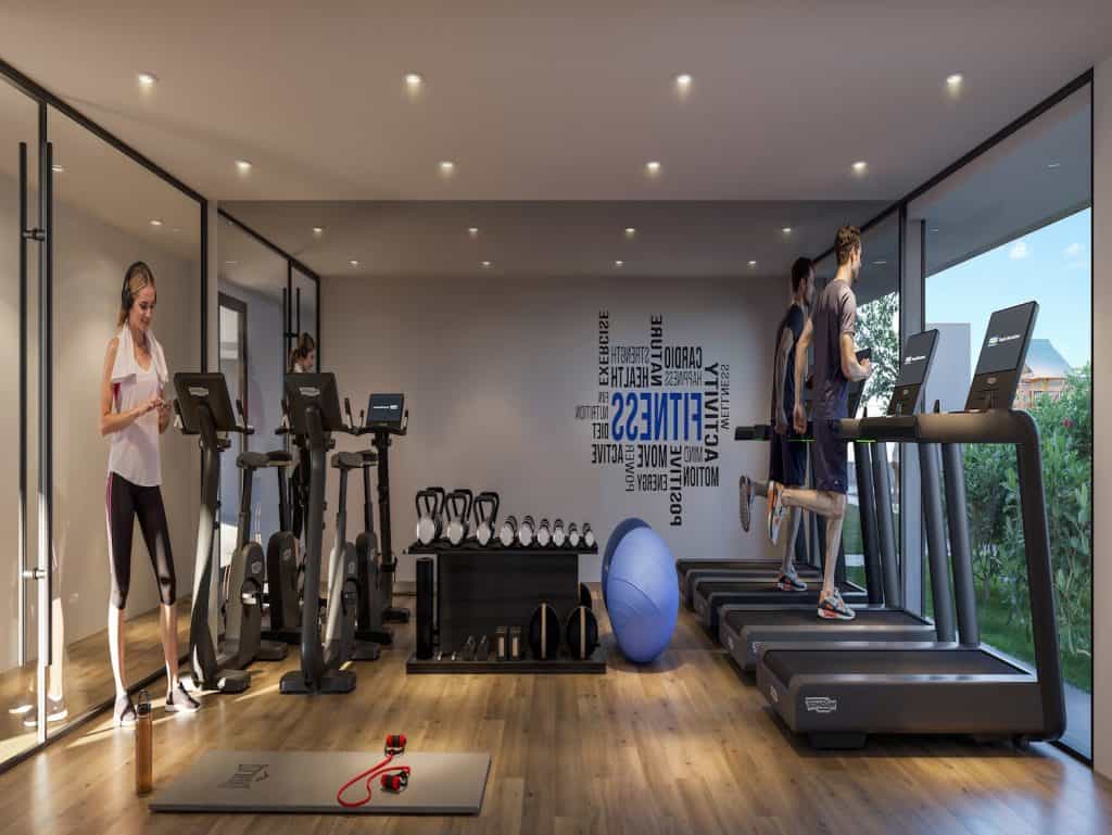 State-of-the-art gym with treadmills, weights, and scenic views for fitness enthusiasts.