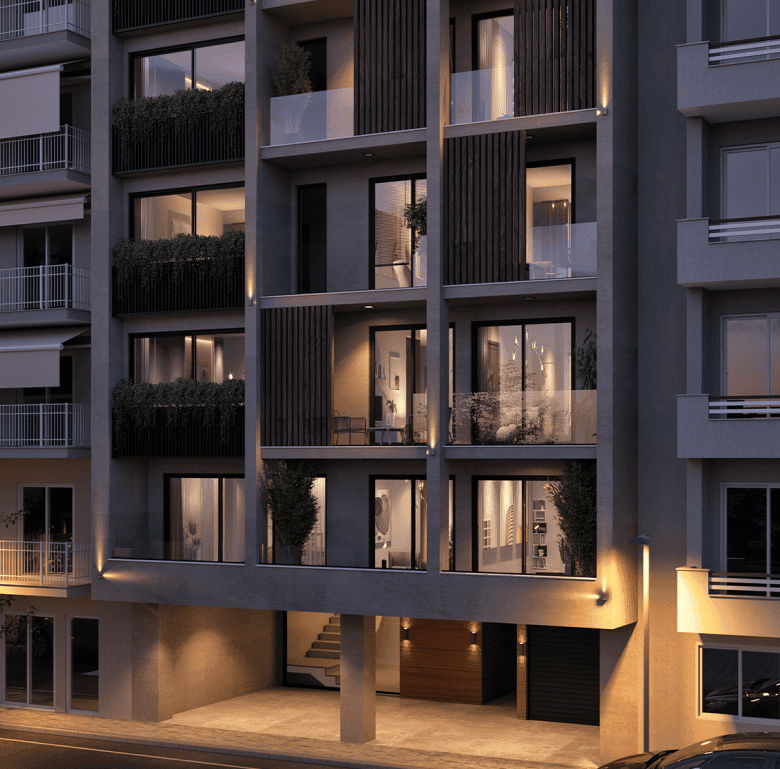 Contemporary apartment building in Athens with illuminated balconies and modern design.