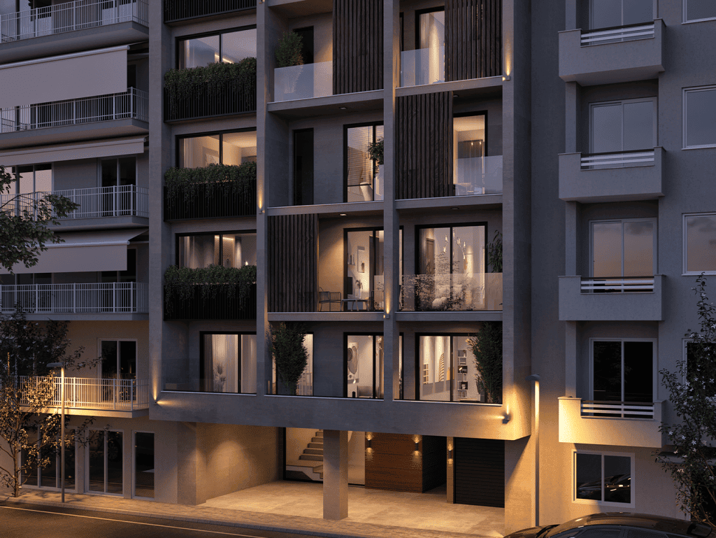 Contemporary apartment building in Athens with illuminated balconies and modern design.